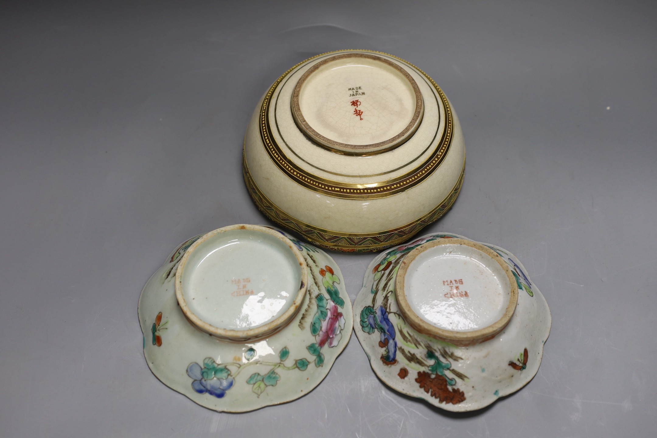 A Japanese Satsuma earthenware bowl, painted with a geisha and two Cantonese famille rose bowls (one af) (3)
